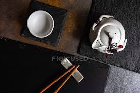 Examples include rectangular lacquered boxes, small rice bowls, dishes, and side dishes. Overhead View Of A Japanese Dinner Table Setting Seafood Chopsticks Rest Stock Photo 462035014