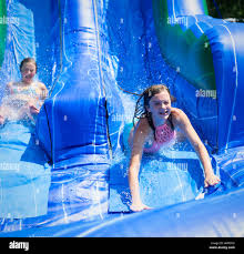 Girl on waterslide hi-res stock photography and images - Alamy