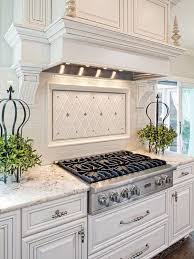 White Kitchen With Light Gray And Silver Accents And A White Tile Backsplash White Kitchen Traditional Kitchen Inspirations Home Kitchens