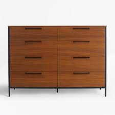 These dressers include both dresser drawers and wardrobe doors that open to reveal shelves or a space to hang clothes. James Walnut With Black Frame 8 Drawer Dresser With Power Outlet Reviews Crate And Barrel