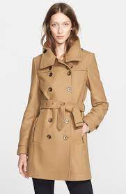 A wardrobe staple for colder months, lend a smart finish to your look with longline and belted macs. A Classic Camel Coat Is A Must For Winter Candie Anderson