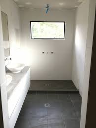 Modern Ensuite With Grey Floor Tiles White Floor To Ceiling Tiles Fixed Panel Shower Window Bathroom Floor Tiles Bathroom Flooring Floor To Ceiling Windows