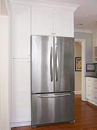 Placing cabinet door hinges in an entire kitchen requires consistency. Proper Placement Before The Kitchen S Remodel The Refrigerator Was A Sore Spot In The Small White Kitchens Corner Kitchen Cabinet Cabinet Depth Refrigerator