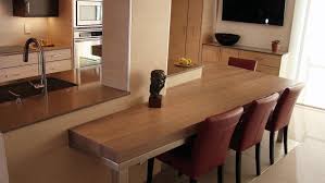 A table used as a portable kitchen island has many uses—it can add extra dining space if you need to bring it into another room when you have guests over for the holidays or other special occasions. Kitchen Island With Dining Table Extension Hgtv