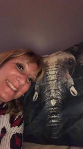 Elephant planter in greenhouse with animal visitor