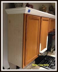 Use a pin nailer to nail into the corners of the two pieces of crown molding (image 2). Kitchen Cabinet Makeover Install Crown Molding Http Helloilivehere Com Kit Kitchen Cabinets Upgrade Kitchen Cabinets Makeover Kitchen Cabinet Crown Molding