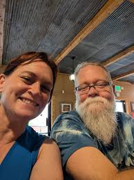 Want to see if anyone got any pictures of my beautiful wife snd I from  Friday. She was wearing a red dress that was basically slit from shoulder  to ankle