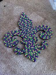 Use beads to make a diy chandelier masterpiece! Mardi Gras Candle Decorations