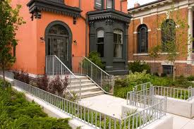 The design team painted the brick exterior white. Restoration Done Right Orange Brick Houses Orange House Red Brick House