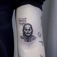 The Best Tattoos With Joaquin Phoenix S Joker Movie Tattoos Joker Tattoo Cool Tattoos