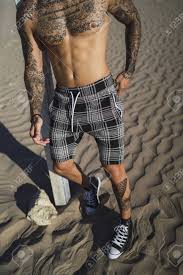 You can also set the curve, add text, image, angels and quotes as well. A Vertical Shot Of A Cool Young Shirtless Man S Body With Tattoos Standing At The Beach On A Sunny Day Stock Photo Picture And Royalty Free Image Image 154643671