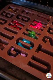 Place the silicone mold on the baking sheet. Easy Diy Crayon Letter Names Fun Crayons Art Fun With Mama