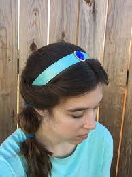 Jasmine inspired Disney running headband. Teal satin non-slip headband with  sapphire blue jewel rhinestone in gold setting. DearTallulah Etsy shop.