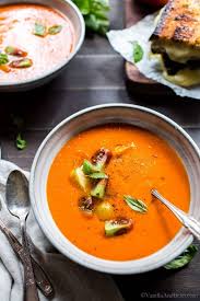 Roasted Red Pepper Tomato Soup In Serving Bowls Garnished With Tomatoes And Basil In 2020 Roasted Red Peppers Vegetarian Soup Delicious Soup
