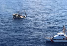 coast guard rescues three from sinking