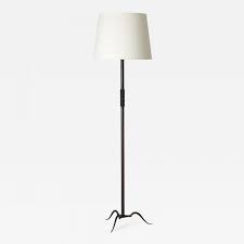 This floor lamp is sometimes called a quilter's lamp because it adjusts up or down making it nice for reading or sewing or other close work. Michel Zadounaisky Art Deco Wrought Iron Floor Lamp By Michel Zadounaisky