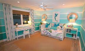 The simplest option for covering the walls of an ocean theme bedroom or nursery is a solid coat of blue paint with a bright undersea theme wallpaper border. Romantic Beach Theme Bedroom Pink Metal Panel Bed Tufted Dark Bedroom Themes Beach Themed Room Ocean Themed Bedroom