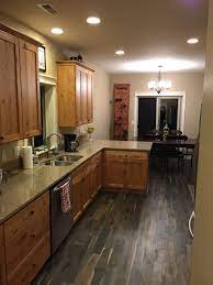 Rather than getting the cabinets refinished again, i decided to paint the walls in my kitchen with the useful gray color. Kentwood Iron Oak Springs Floors With Knotty Alder Cabinets And Quartz Countertops Kentwood Knot Kitchen Flooring Alder Kitchen Cabinets Oak Kitchen Cabinets