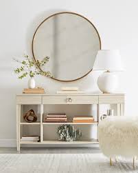 Love This Simple All White Entryway Look With A Tiered Console Table Sheepskin Ottoman And Oversized Round Mirror Interior Home Decor Accessories Home Decor