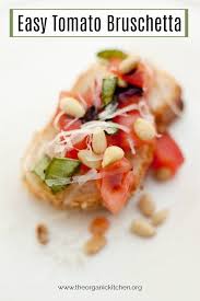 A Slice Of Easy Tomato Bruschetta Garnished With Parmesan Pine Nuts And Basil On White Plate In 2020