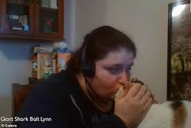 Cat causes nuisance as she attacks owner's microphone