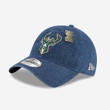 Green with the milwaukee bucks front logo, the new era side logo, and the bucks rear strap logo. New Era Milwaukee Bucks Draft 2018 9twenty Cap