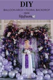 Tie a ribbon or string to the center of the first grouping of balloons. How To Diy A Fiercesome Floral Balloon Arch For Your Wedding