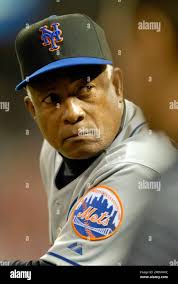 New York Mets' Sandy Alomar Sr, sits in the dugout during the ninth inning  of their baseball game against the St. Louis Cardinals