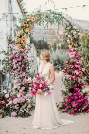 Whether you get married in the middle of a field or in the sanctuary of a church, floral arches can give your space added color and structure. All The Feels With This Ombre Floral Wedding Inspiration Ruffled