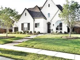 We virtually paint brick houses everyday and know what works and what doesn't. Black Gutters 97 Decoratio Co White Stucco House White Brick Houses Brick Exterior House