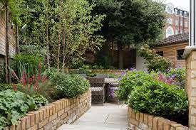 If feasible, create a broad, sturdy ledge at a comfortable sitting height along the sides of the beds to allow gardeners to sit rather than stand or squat while. How To Create A Secluded Spot In A Small Garden Houzz Uk