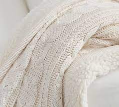 I love this knit throw, the color is a natural, neutral shade that would goes with about everything. Cozy Cable Knit Throws Pottery Barn