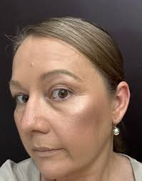 What skin care products do you recommend for a person approaching 50 with a  limited budget, looking for a daily foundation with sun protection?