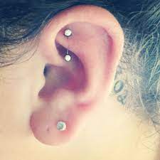 Pin By Kristina On Tats Piercings Ear Piercings Rook Tragus Piercing For Migraines Ear Piercings