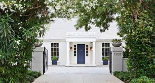 Your awnings are blue and white, so while a blue door is a good choice imo, you could also try orange, red, fuchsia. Blue And White Monday Curb Appeal The Pink Pagoda