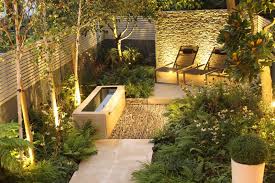 Let's get the ideas flowing. Backyard Landscaping Ideas Dense Greenery Complemented By A Rock Texture The Barnsbury Townhouse Garden