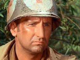 Watching all Combat! Series. On S1/E27, Conlan Carter /Doc plays an MP  before he got the part of Doc a season later. He is still around at the age  of 89.