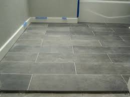 1 x 1 gray floor tile was utilized in the shower to further extend and anchor the space, continuing the dark tones into the shower space. 25 Gray Floor Tile Ideas Grey Floor Tiles Tile Floor Kitchen Flooring