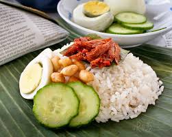 Pasti nasi lemak ni sebungkus pun tak cukup. Nasi Lemak Bungkus Coconut Flavored Rice With Spicy Anchovies Wrapped In Banana Leaves Roti N Rice