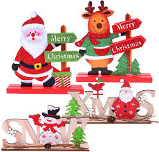 Transform your dining room table with fun and colorful table decorations, like candle holders, table vases, napkin rings, candles, and other decorative objects. Amazon Com Set Of 4 Christmas Table Decorations For Dinner Party Wooden Table Display Santa Snowman For Home Restaurant Cafe Table Decoration Merry Christmas Holidays Centerpiece Toys Games