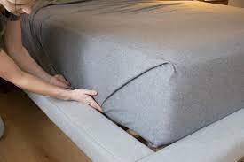 Sheet straps are elastic with clips made of plastic on their ends. How To Make A Bed With Tight Hospital Corners Hgtv