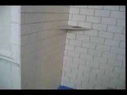 The tile stops at the outside qr, where the red line is in the pictures. Subway Tile Master Bathroom With Chair Rail And Marble Liner Border And Mosaic Marble Floor With Borde Subway Tiles Bathroom Ceramic Subway Tile Tile Bathroom