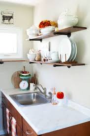 Decorating the cabinet with vintage kitchen necessities will add more rustic value to the whole design. Love Your Dark Kitchen Cabinets Using Fall Colors My Wee Abode