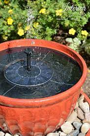Then you place a planter saucer at the top of the flower pot so the birds can use it as a diy bird bath. Bird Bath Solar Pump In Diy Plant Pot Water Fountain The Interior Frugalista Diy Garden Fountains Bird Bath Fountain Diy Fountain