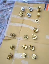 Place the doorknob pieces on a drop cloth and paint them with latex primer paint using a foam paintbrush. How To Upgrade Your Old Brass Door Knobs With Spray Paint Young House Love
