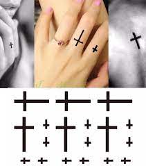 Often regarded as a christian symbol for obvious reasons, cross tattoos are among the most popular motifs as a way to express one's spirituality or religious conviction. Waterproof Temporary Tattoo Sticker Small Cross Sun And Moon On Finger Ear Tatto Flash Tatoo Fake Tattoos For Girl Women Men Small Cross Tattoo Cross Tattoowaterproof Temporary Tattoos Aliexpress