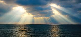 The sun rays shined the afternoon sky through the gap between the clouds. Beams Of Sunlight Rays Shining Through Dramatic Clouds Onto The Photograph By Gill Copeland