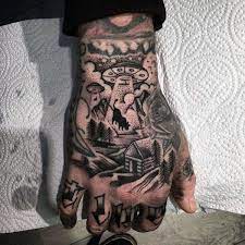 Top 63 Alien Tattoo Ideas 2021 Inspiration Guide Hand Tattoos For Guys Hand Tattoos Alien Tattoo