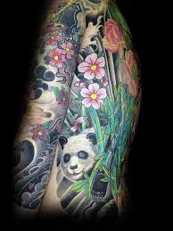 Flower tattoo designs can be large, small, black, grey, white, colorful, or anything in between. Lifelike Colored Tattoo Of Panda Bear With Flowers And Bamboo Tattooimages Biz