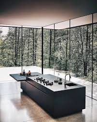 Minimal Black Kitchen Island Bench Surrounded By Tall Windows With Natural Light Modern Home House Design Maison Moderne Cuisine Moderne Maison Design